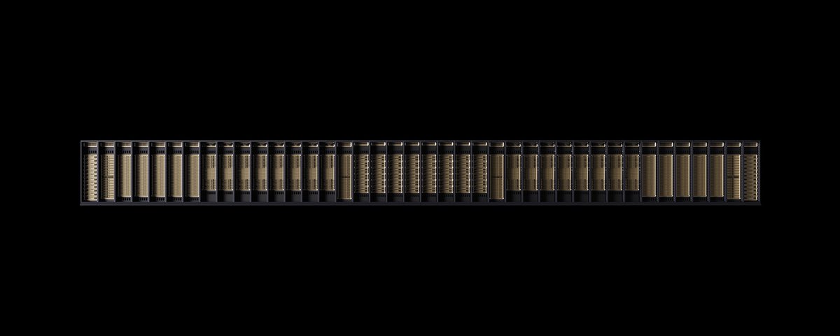 A row of AI computing racks against a black background.